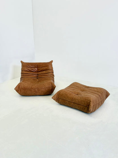 Ligne Roset Togo fauteuil met poef in cognac leer