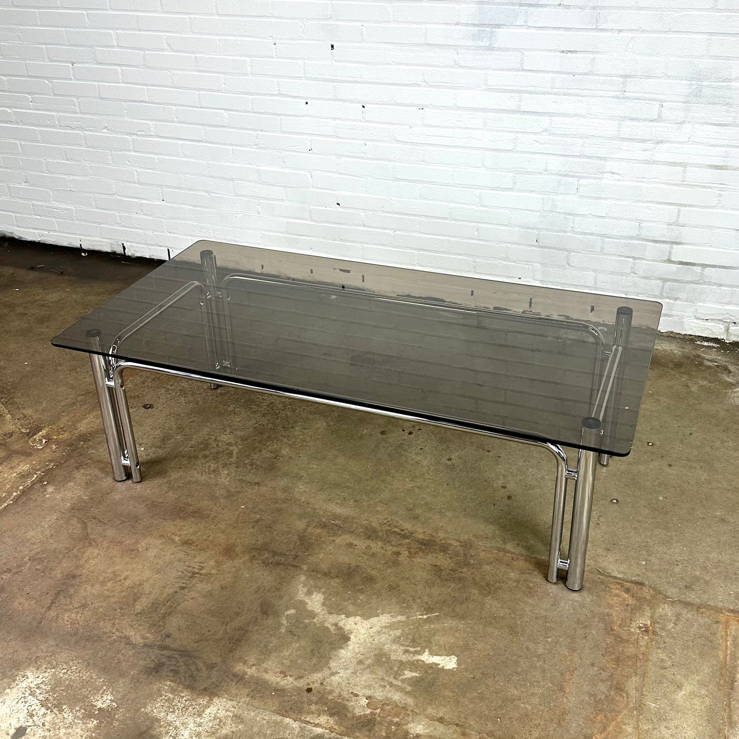 Rectangular vintage coffee table in chromed metal and smoked glass