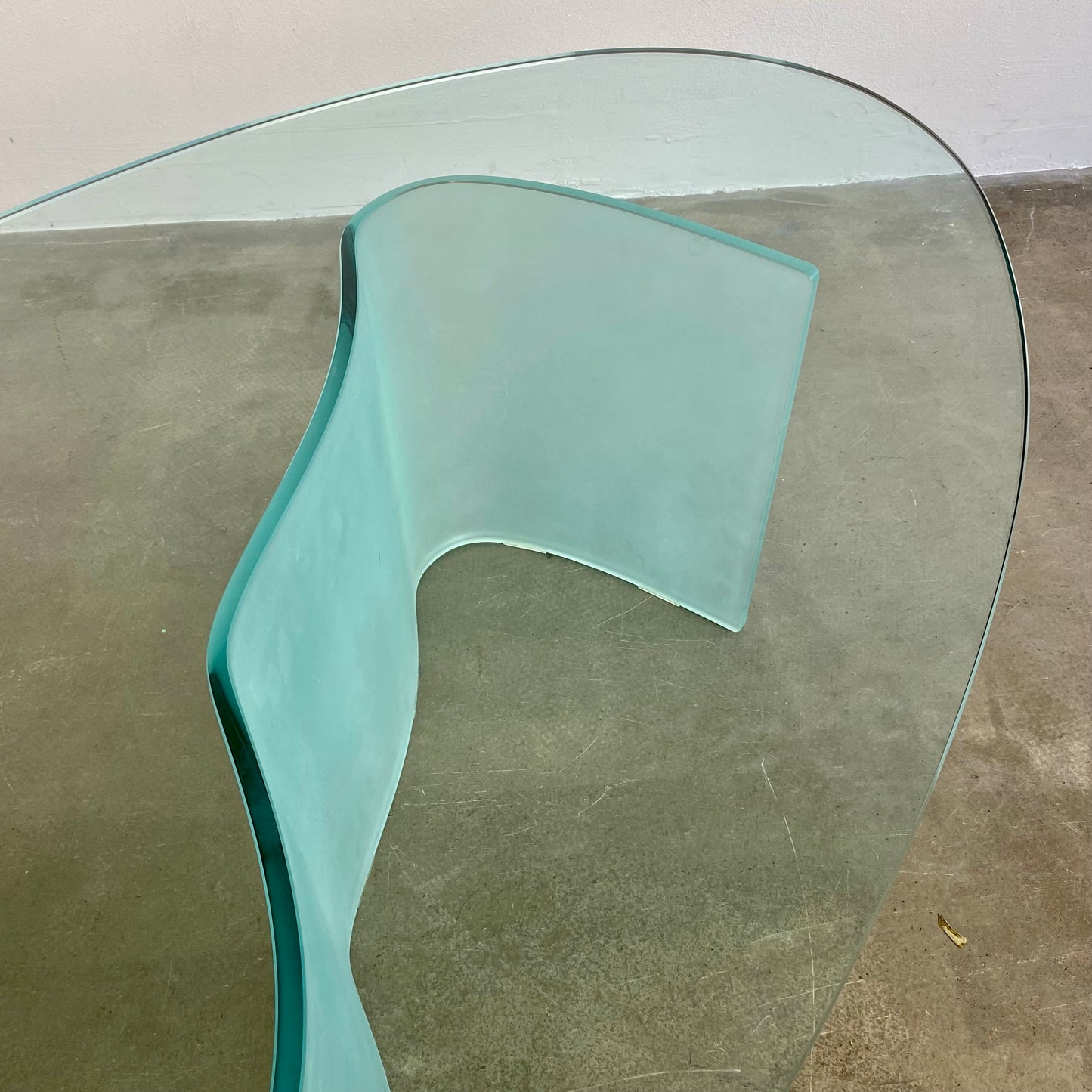 Glass coffee table with wave legs