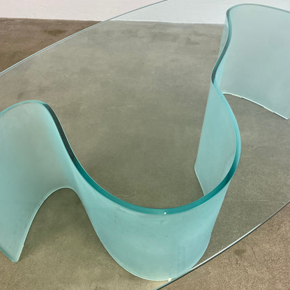 Glass coffee table with wave legs