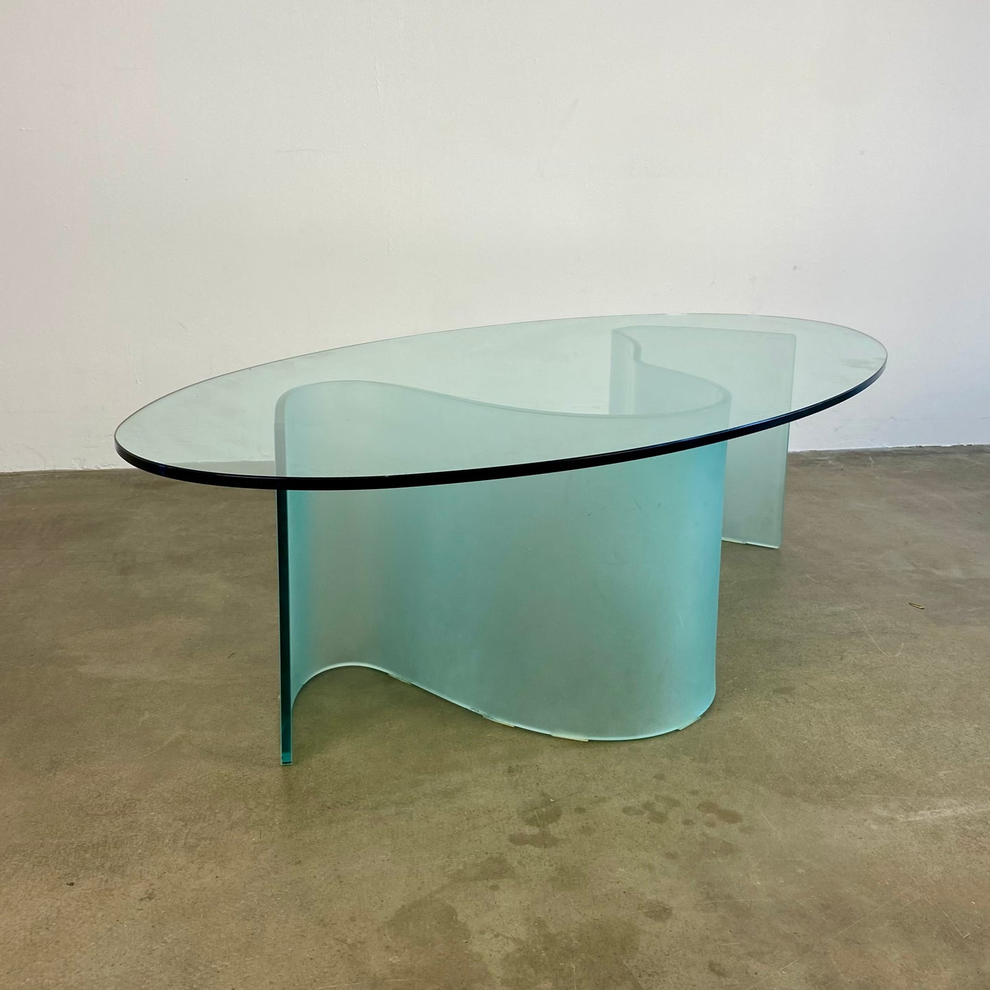 Glass coffee table with wave legs