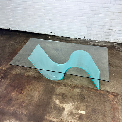 Glass coffee table with wave leg