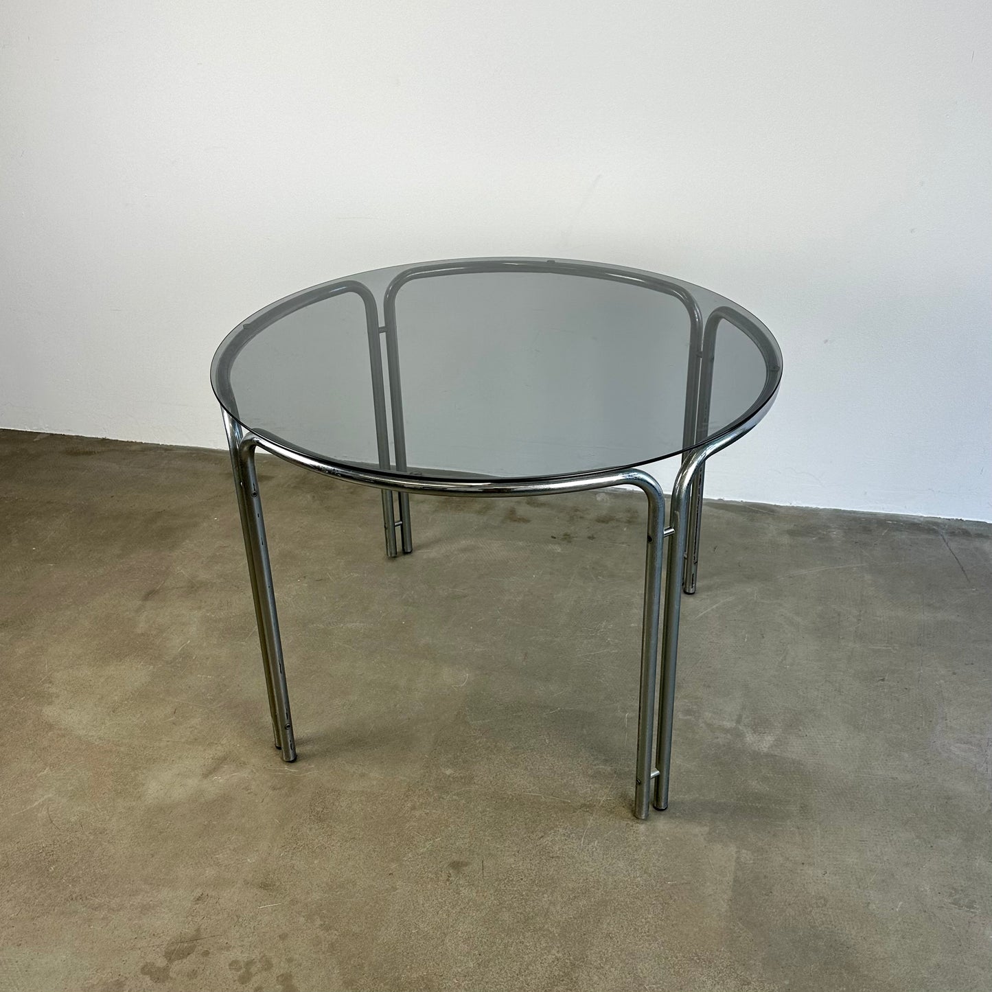 round-vintage-dining-table-with-smoke-glass