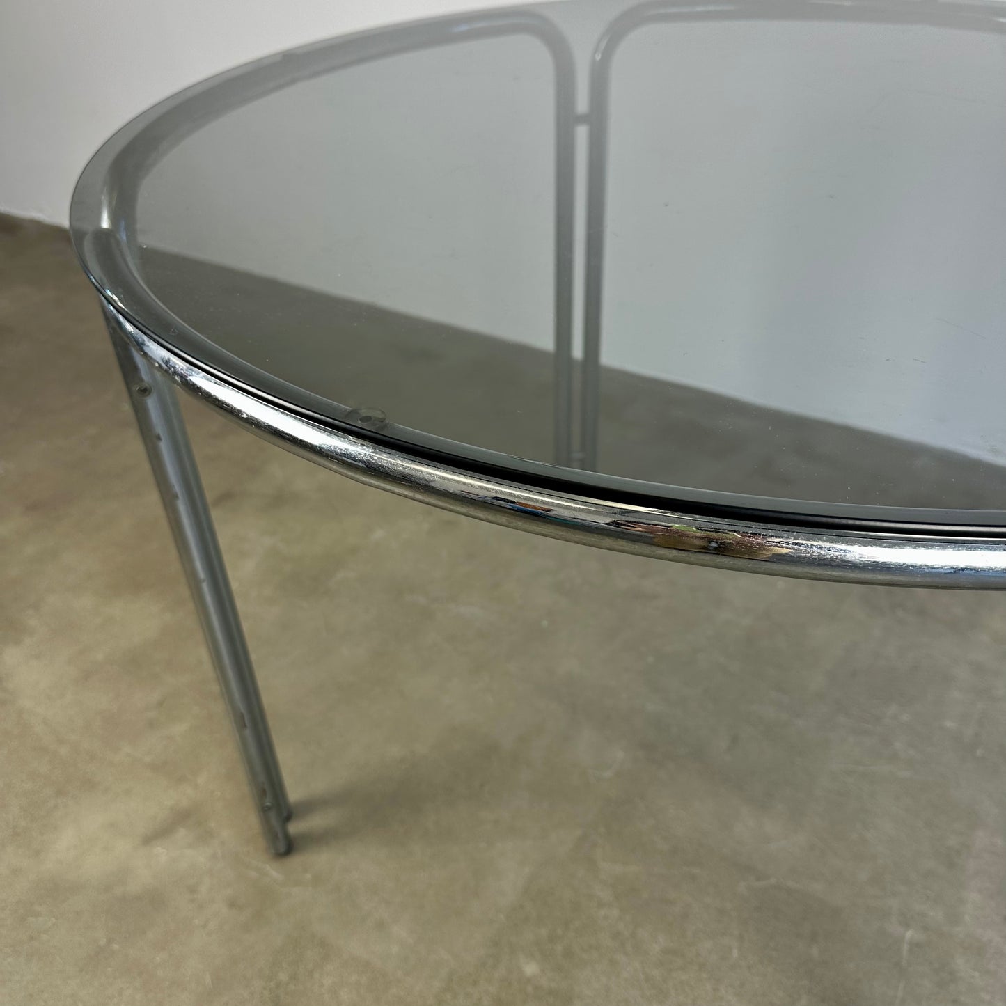 Round vintage dining table with smoke glass