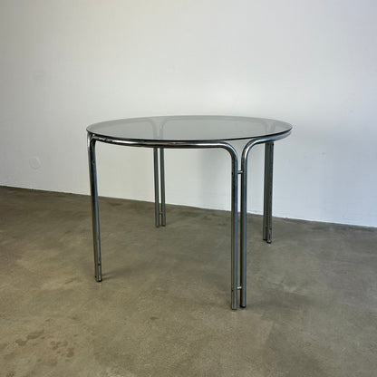 round-vintage-dining-table-with-smoke-glass