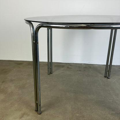 round-vintage-dining-table-with-smoke-glass