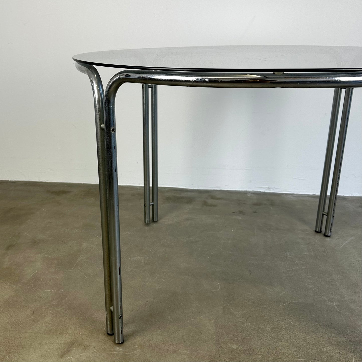 round-vintage-dining-table-with-smoke-glass