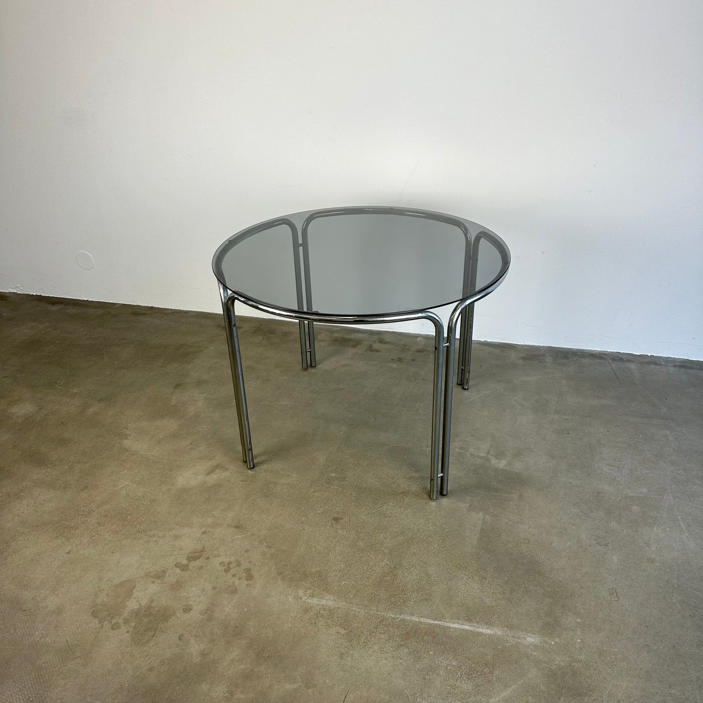 Round vintage dining table with smoke glass